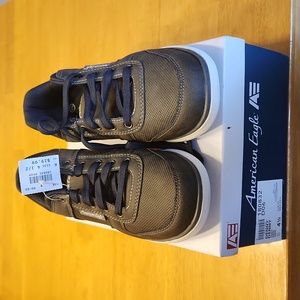 Youth Size 4.5 American Eagle grey tie shoe. Brand new, tags and in box.